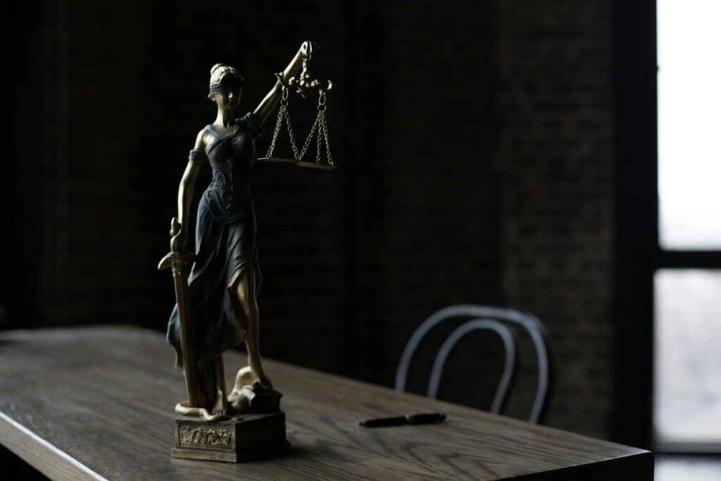 A wooden gavel placed on a legal document, symbolizing the Supreme Court of Kenya's 2024 ruling in Freedom Limited v Mbarak on land ownership and appellate evidence.